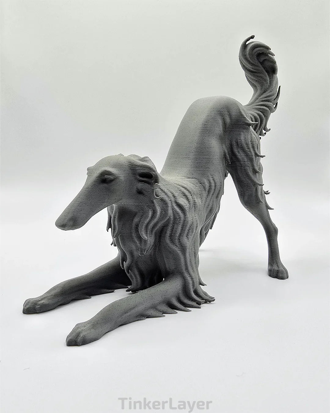 Side view of playful stretching Borzoi statue printed in dark marble PLA