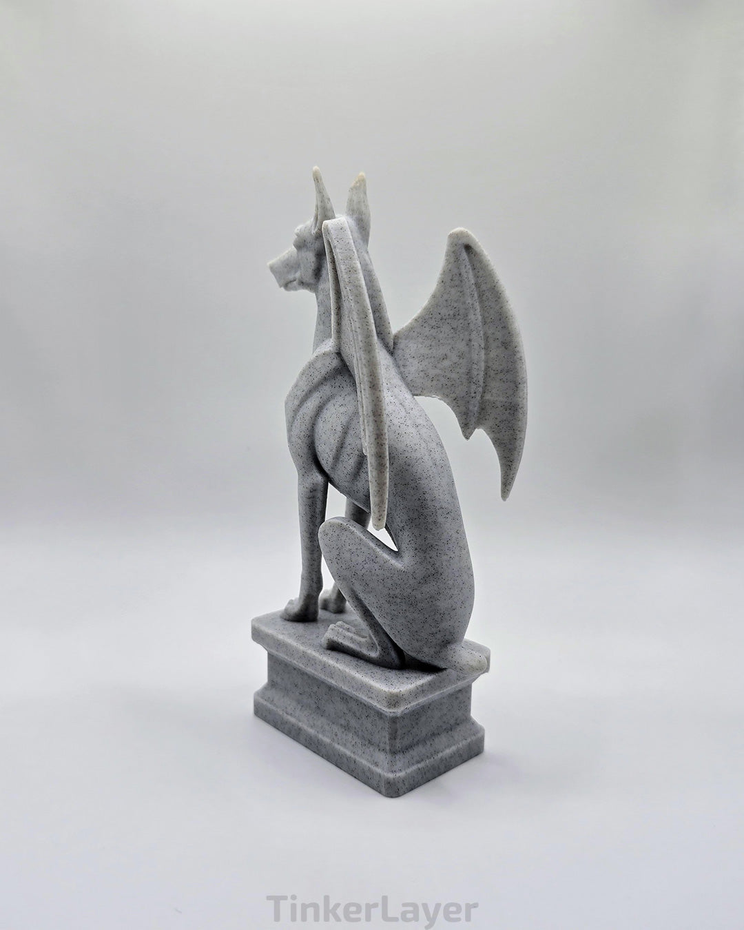 Rear view of a gothic Doberman gargoyle statue printed in marble PLA