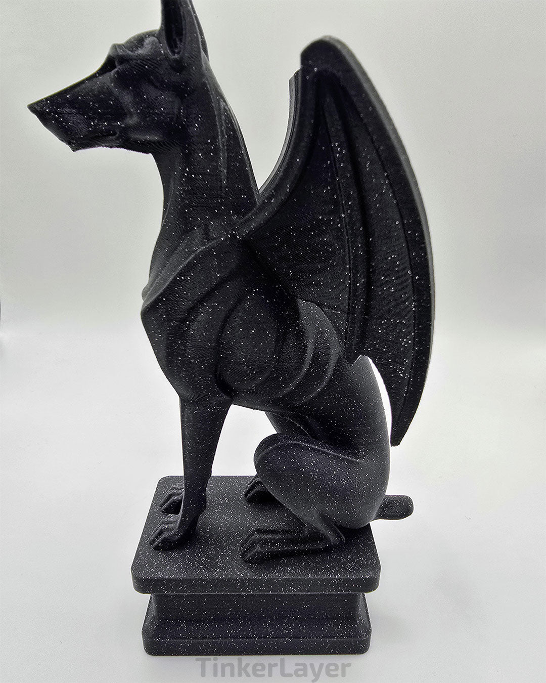 Side view of a gothic Doberman gargoyle statue printed in black and gray shimmer gradient PLA