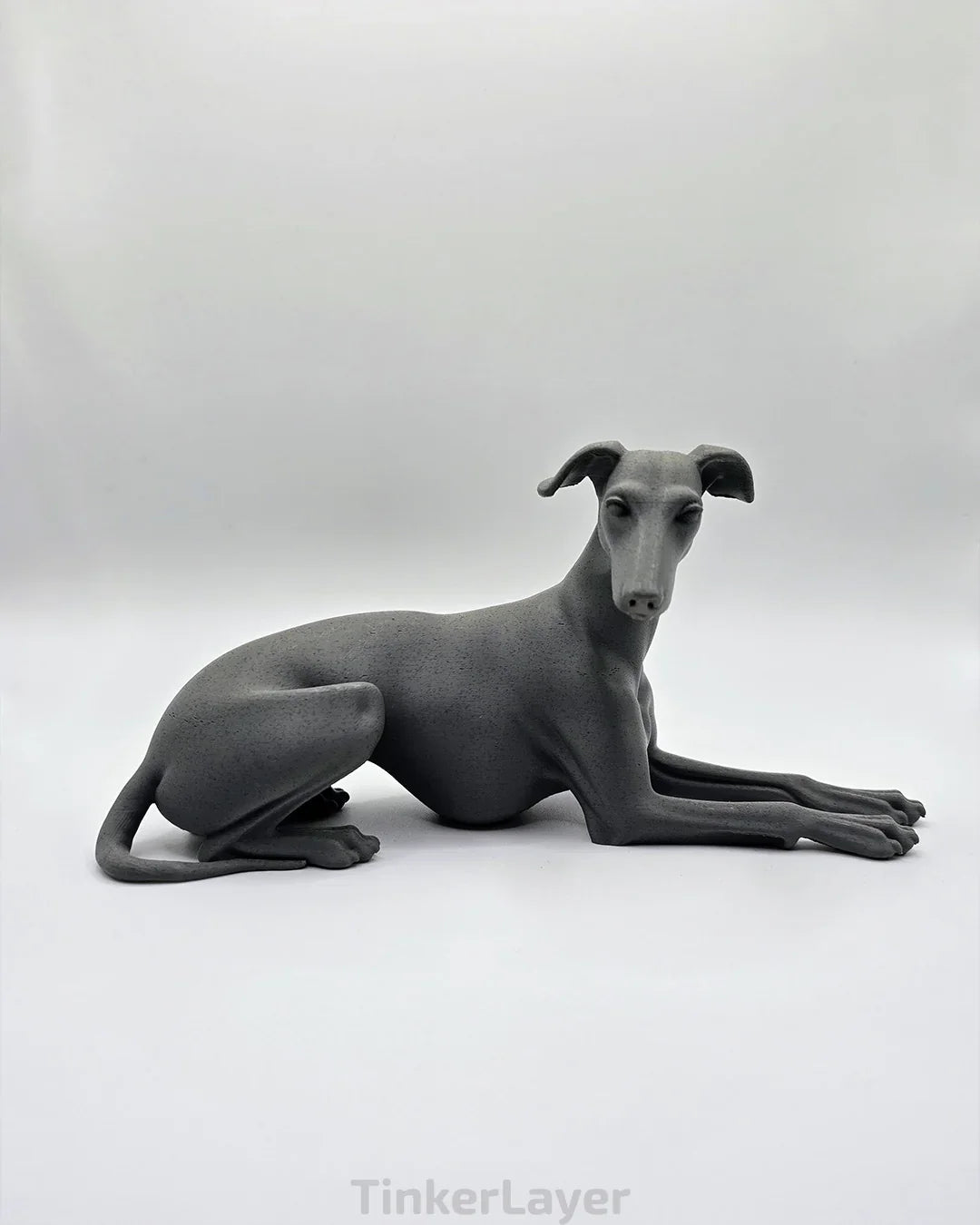 Side view of a laying Whippet or Greyhound printed in dark marble PLA