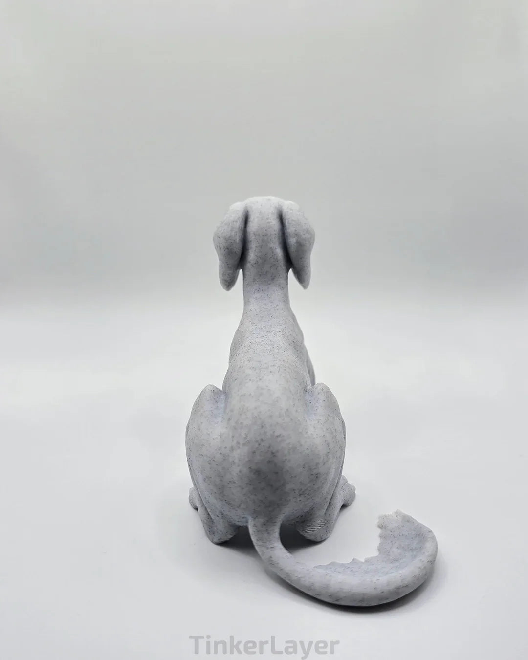 Rear view of laying Saluki statue in marble PLA