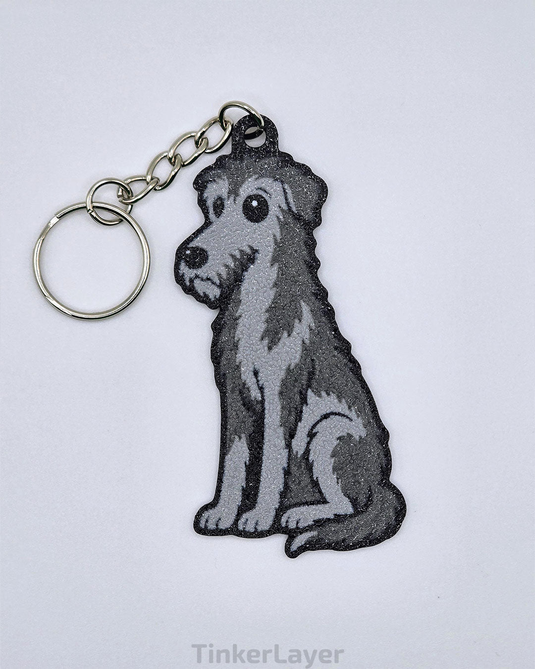 Chibi-style Irish Wolfhound keychain in gray and white on a white background