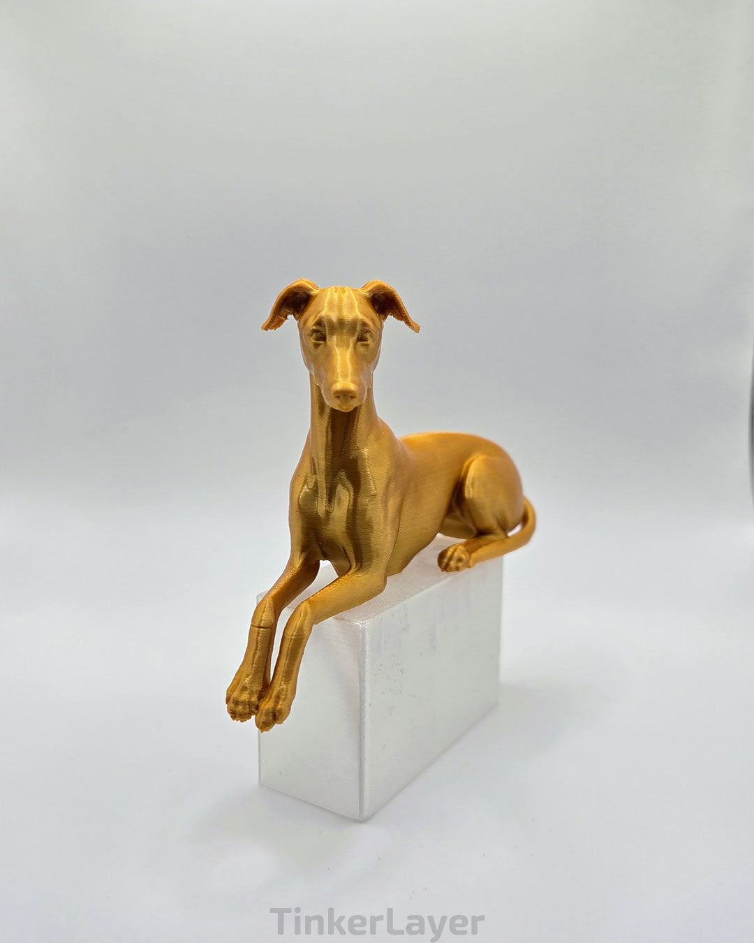 Whippet Shelf Lounger in Silk Gold, bent legs, left facing